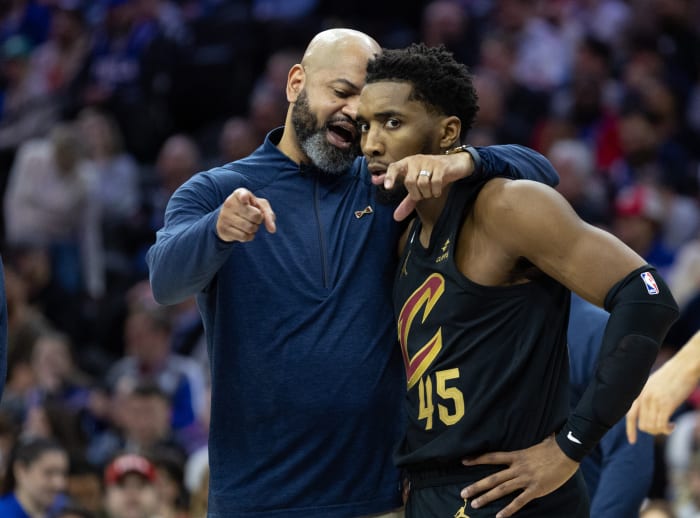 Feb 15, 2023; Philadelphia, Pennsylvania, USA; Cleveland Cavaliers head coach J.B. Bickerstaff talks with guard Donovan Mitchell (45) during a break in the second quarter against the Philadelphia 76ers at Wells Fargo Center. Mandatory Credit: Bill Streicher-USA TODAY Sports